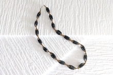 Load image into Gallery viewer, Short necklace with elongated paper beads in bundles &quot;Senta&quot;

